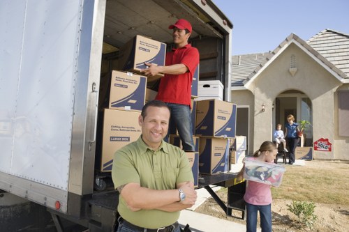 Packed office boxes and furniture ready for transport