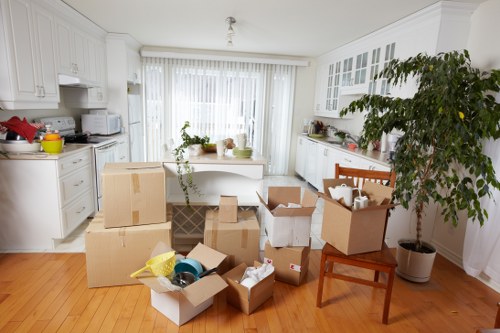 Packed boxes and protective wrapping prepared for removals in Ladbroke Grove