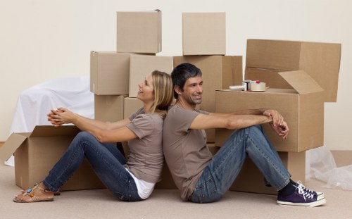 Loading furniture and boxes into a moving truck in Ladbroke Grove