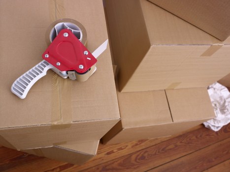 Prepared office boxes and furniture ready for relocation in Ladbroke Grove