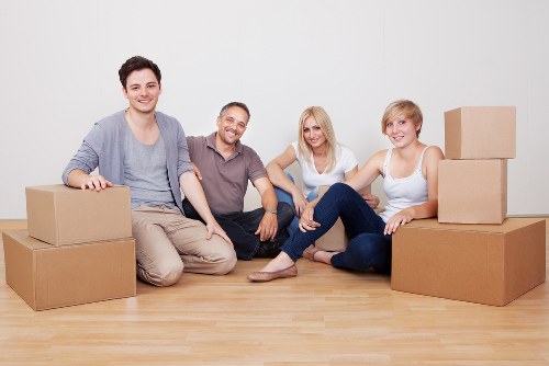 Packed moving boxes and furniture ready for transport in west London
