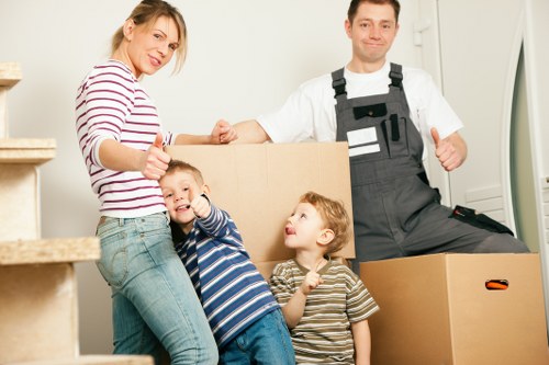 Professional movers handling home furniture for a local relocation